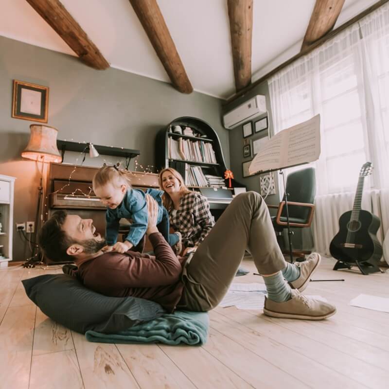 Family playing together in a living room