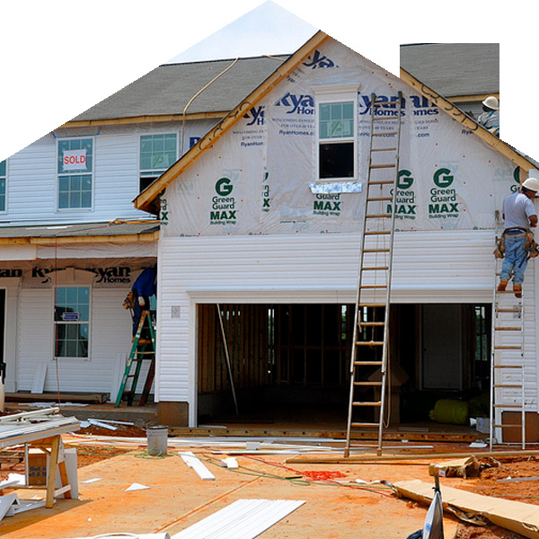 new construction inspections — Construction workers installing siding and house wrap on a new home